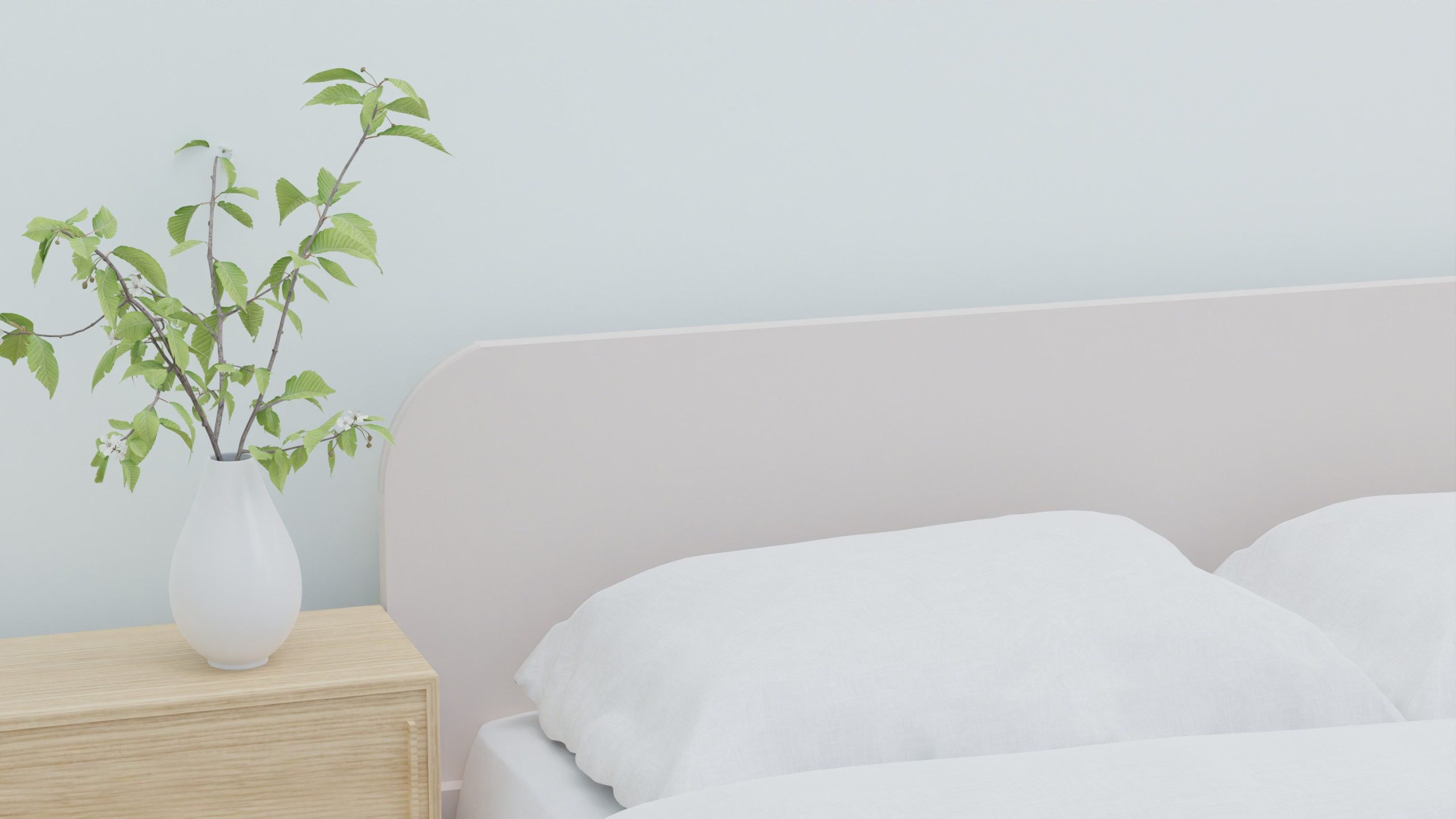 Chambre apaisante literie blanche plante verte